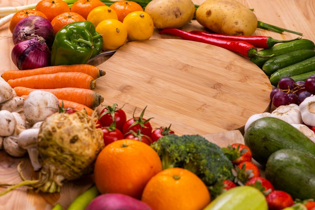 Seasonal autumn vegetables and mushrooms on a wooden table