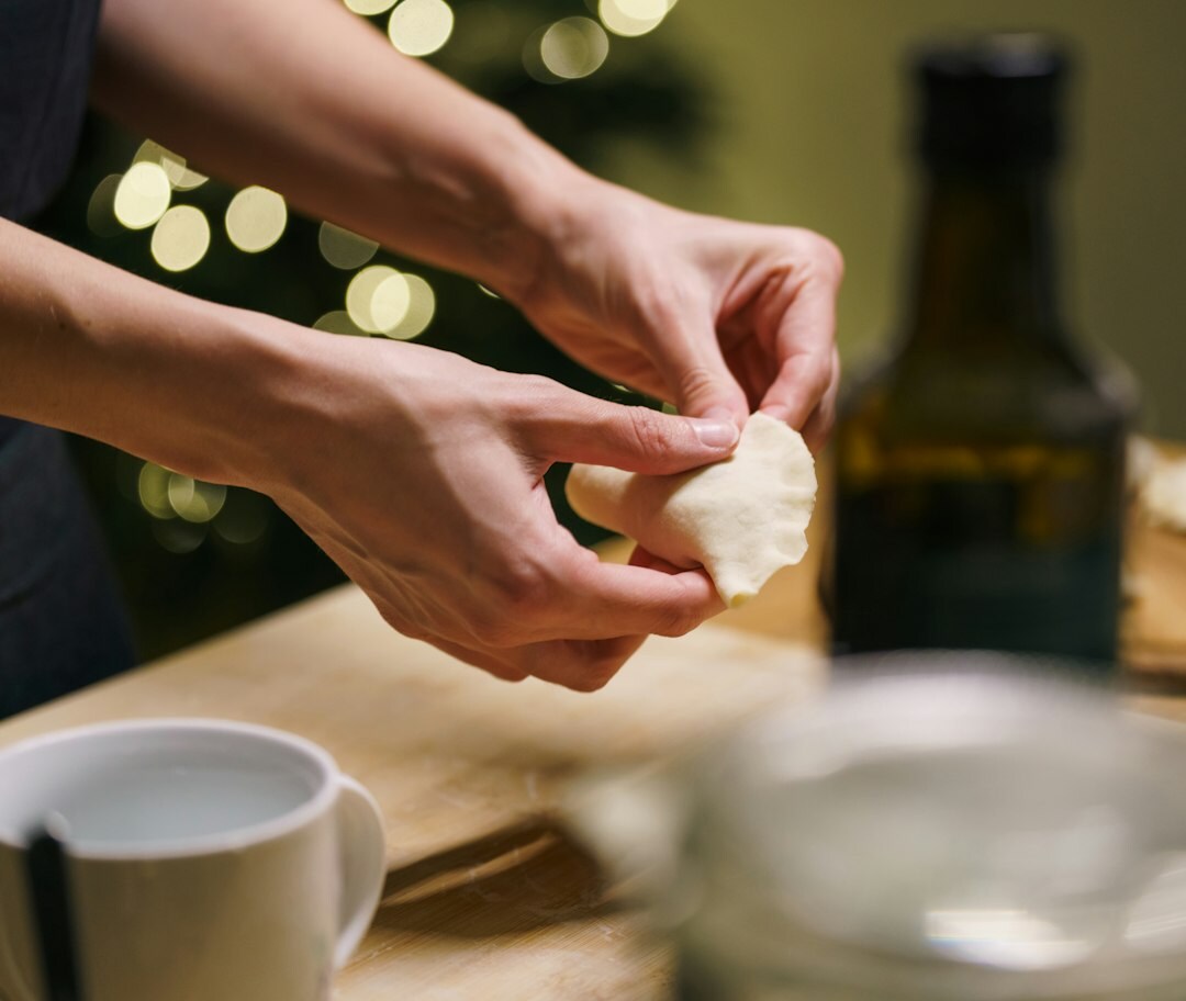 Woman kneading dough in a home kitchen