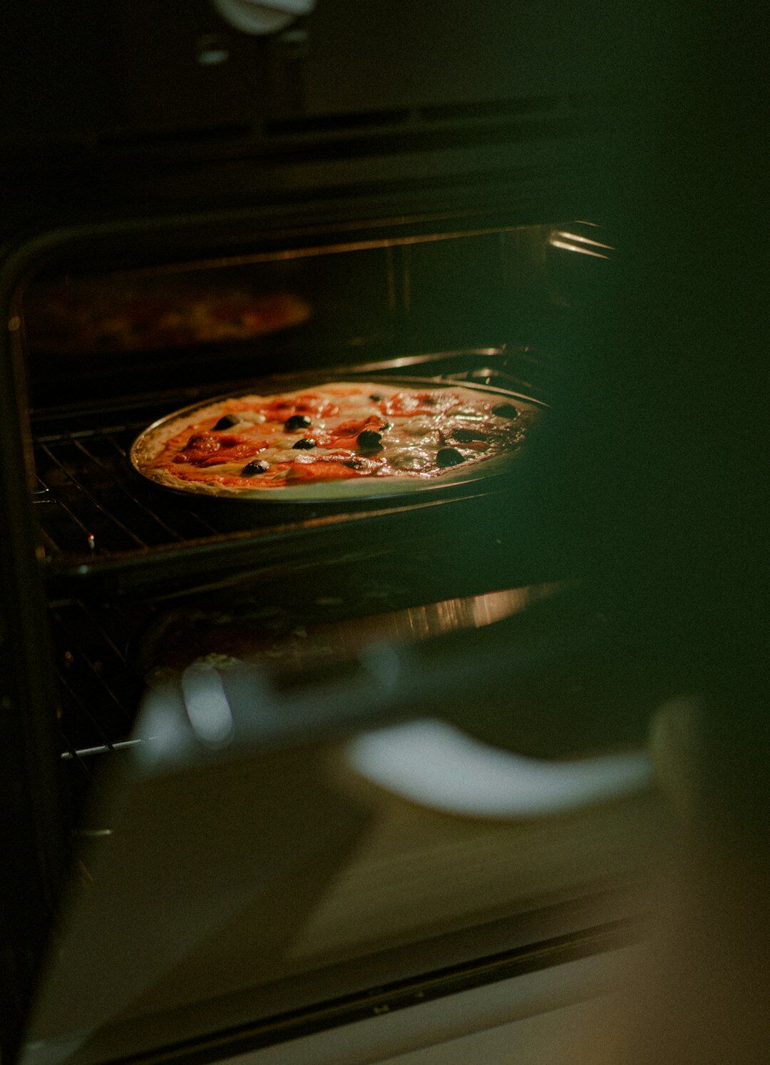 lasagna baking in oven